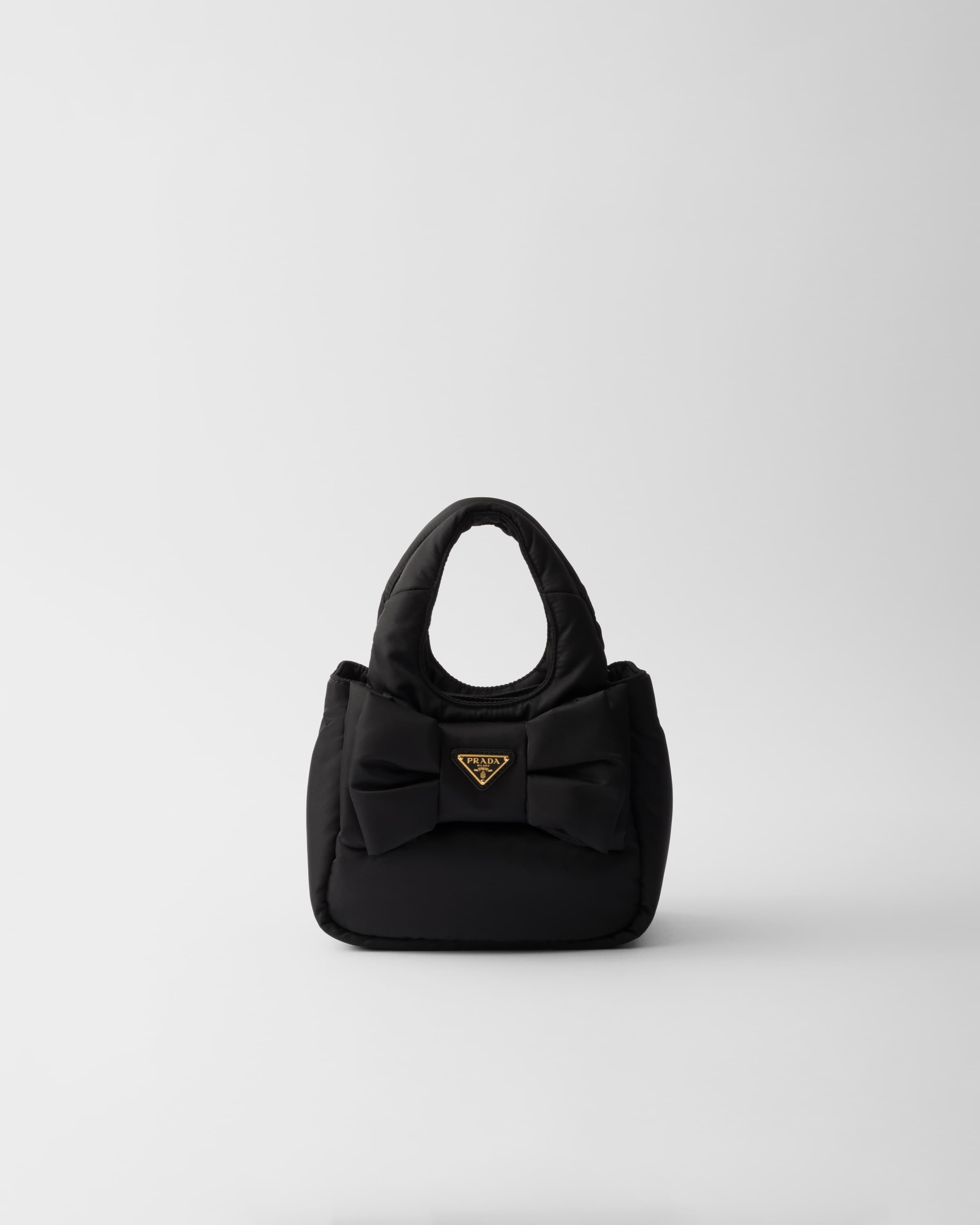 Mini padded Re-Nylon bag with bow — Black — 1BA359_RP0C_F0002_V_OXO